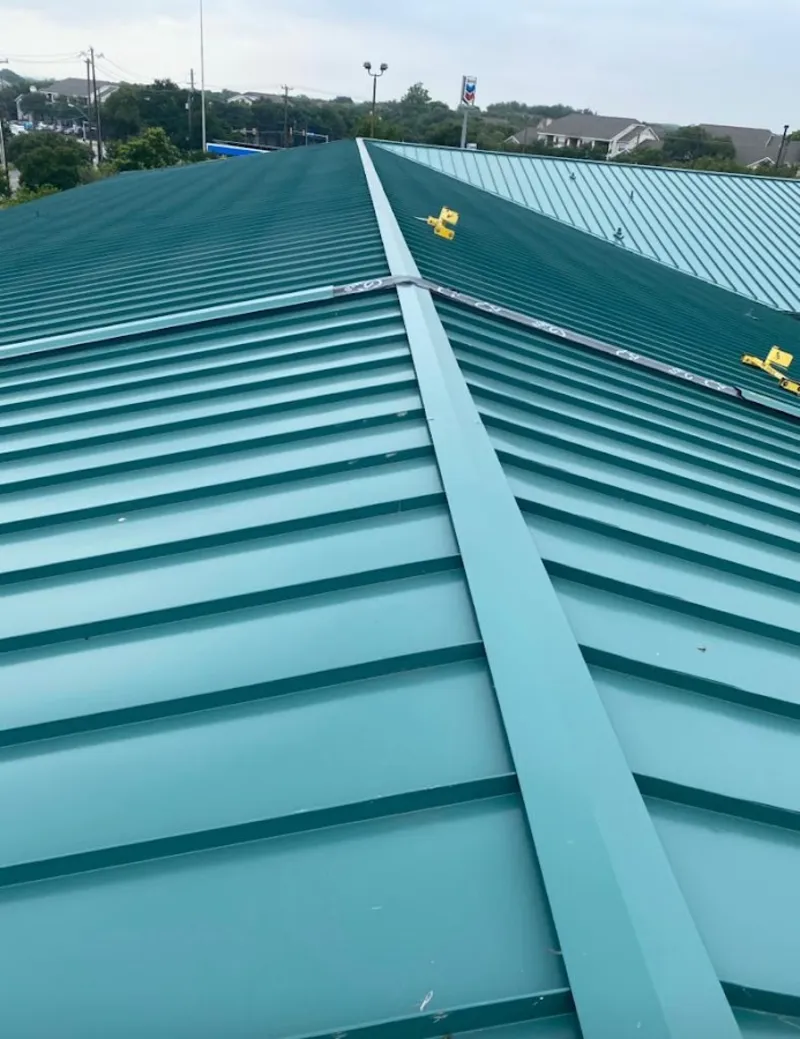 Green commercial metal roof ridge and valley for Metal Roof Repair in Clinton